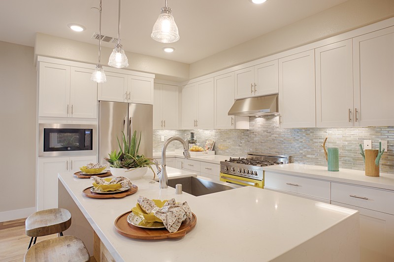 Symmetry at Alameda Landing offers three-story, attached townhome-style condominiums with well-equipped eat-in kitchens and floorplans with two to four bedrooms.
