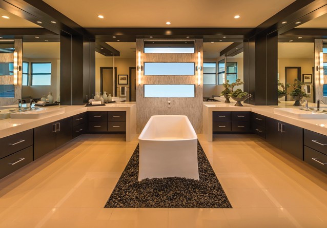 Gorgeous attention to detail in the Premier Plan Two spa-like Master Bath including the show-piece tub and dual-vanity counter space are supported by low water use plumbing fixtures, and tankless water heaters to help water conservation, serving both homeowner and environmental needs in a water-scarce area like Las Vegas.
